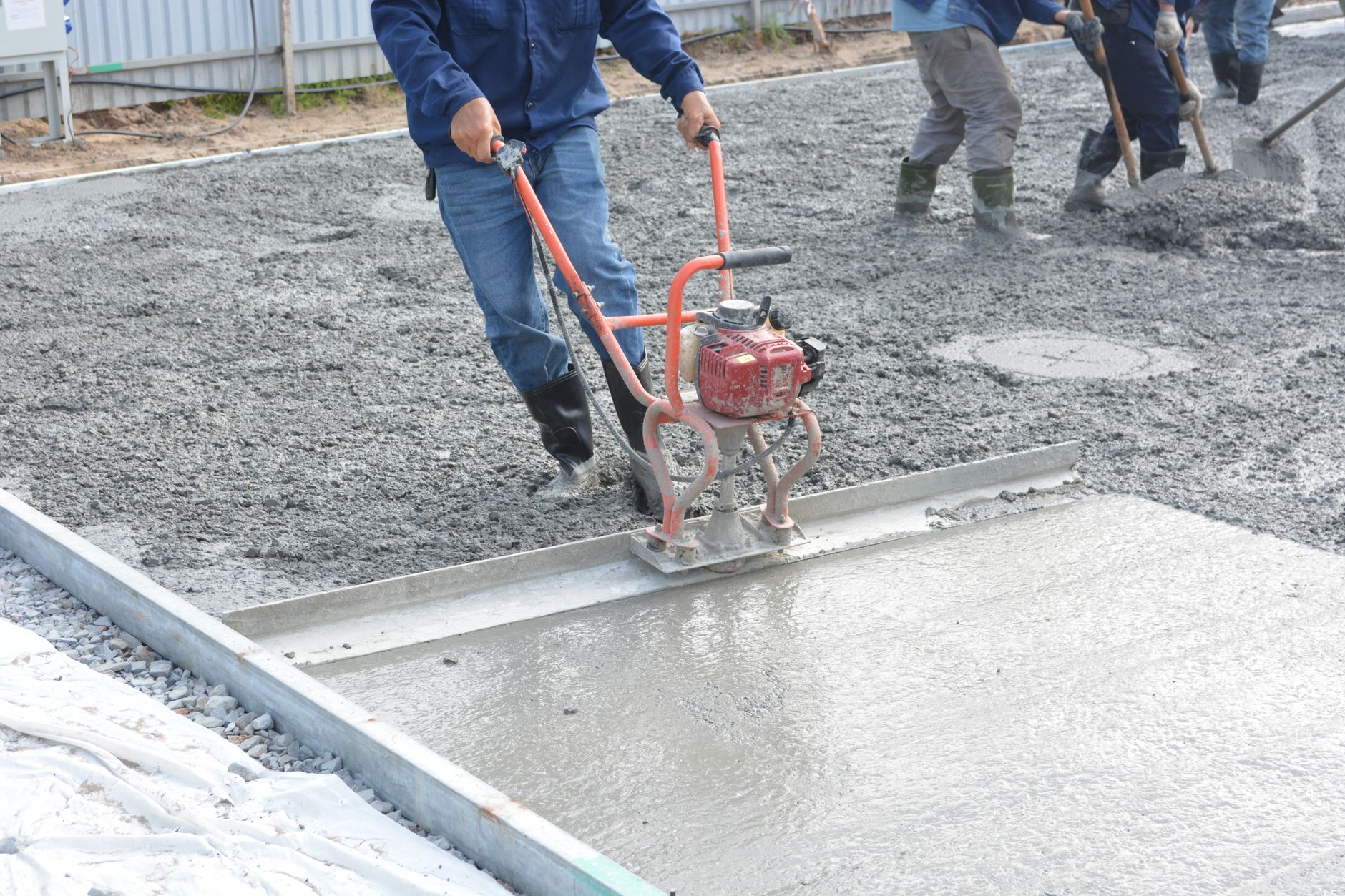 Premier team leveling fresh concrete on a Nashville-area project