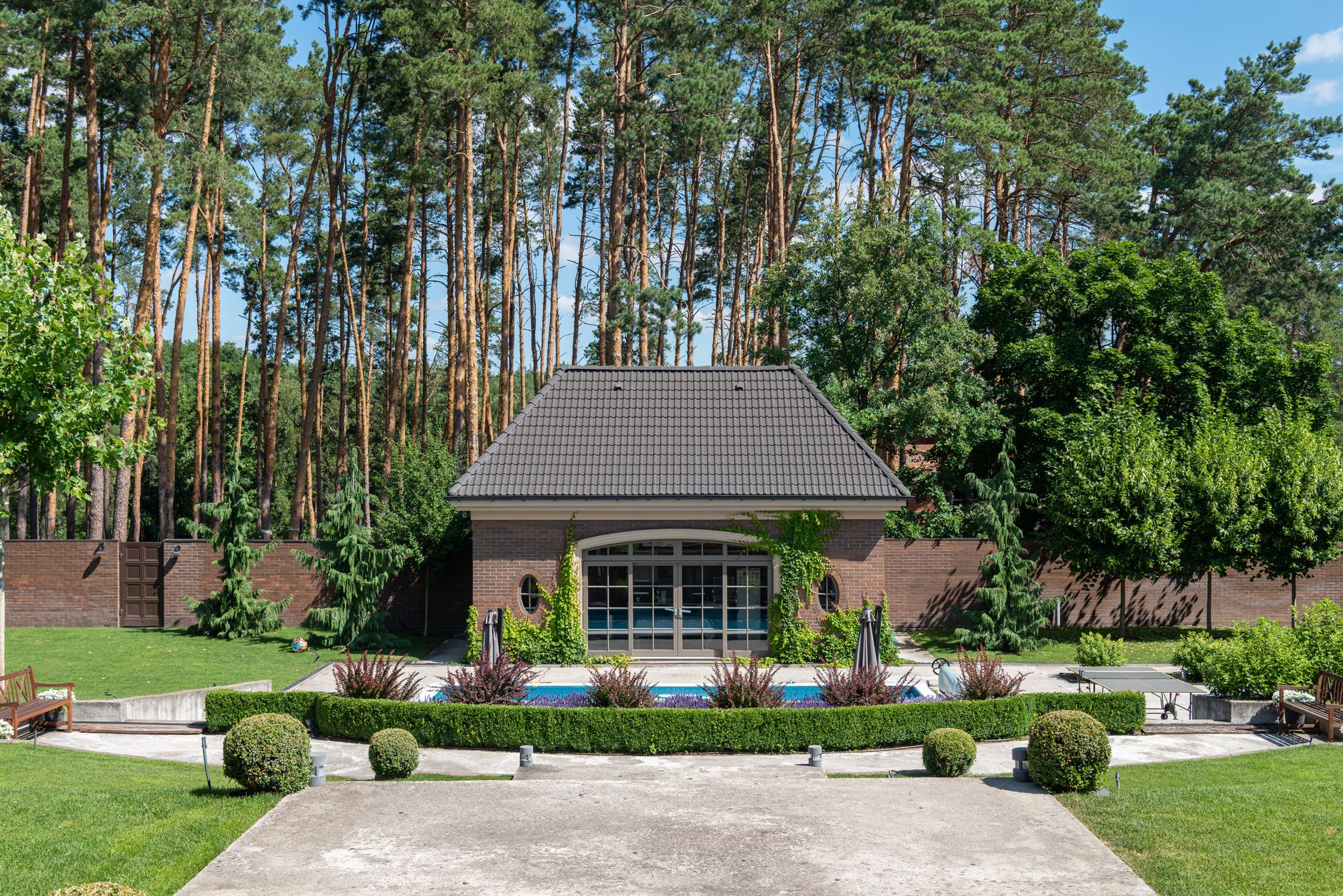 Modern backyard patio with pool and decorative concrete